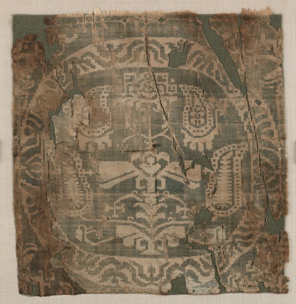 Roundel with angular palmette tree, from a tunic, 650-850. Egypt or possibly Syria. Samite: silk;