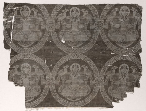 Lampas fragment with seated prince holding falcons in kufic medallions, 1654-1955. Probably Iran.