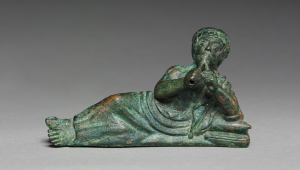 Vessel Ornament of Reclining Flutist, probably 400-375 BC. Italy, Etruscan, early 4th Century BC.