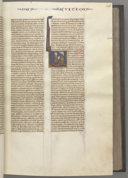 Fol. 36r, Leviticus, historiated initial V, Moses offering a sacrificial lamb on an altar, c.