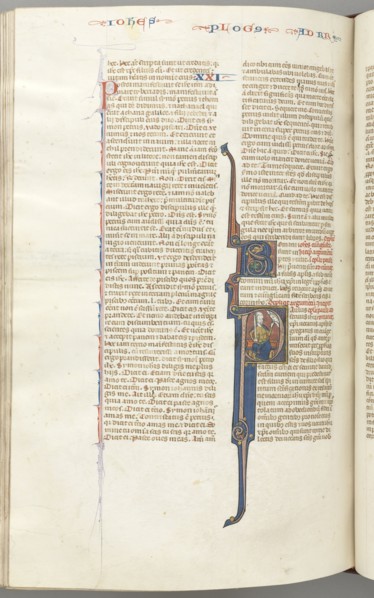 Fol. 435v, Romans, historiated initial P, Paul seated with a sword talking to the bust of God