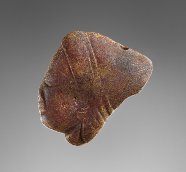 Pendant: Female Head in Profile; Italy; 500 - 480 B.C; Amber; 44 × 38 × 16 mm, 1 3,4 × 1 1,2 × 5,8 in