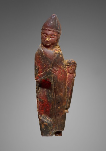 Pendant: Female Holding a Child, Kourotrophos, Italy; 600 - 550 B.C; Amber; 130 × 45 × 18 mm, 55.2 g, 5 1,8 × 1 3,4 × 11,16 in