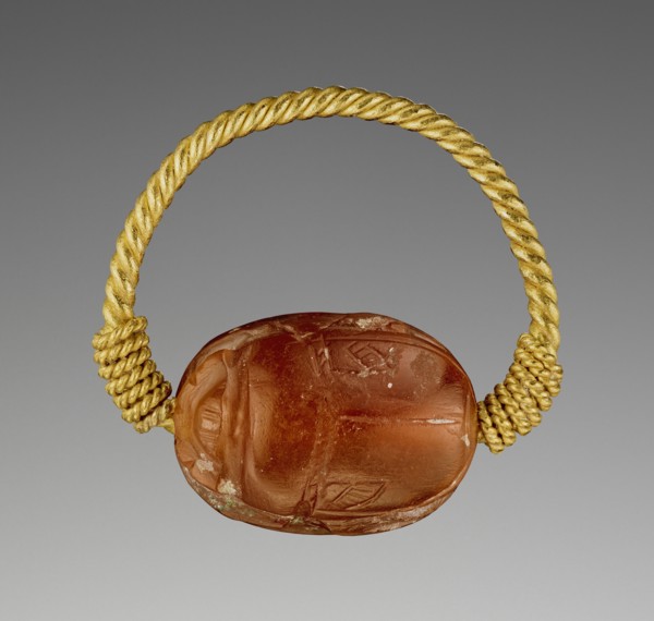 Gem Engraved with a Two-Horse Chariot and Driver; Etruria; 400–300 B.C; Carnelian and gold; 0.8 × 1.5 × 1.2 cm