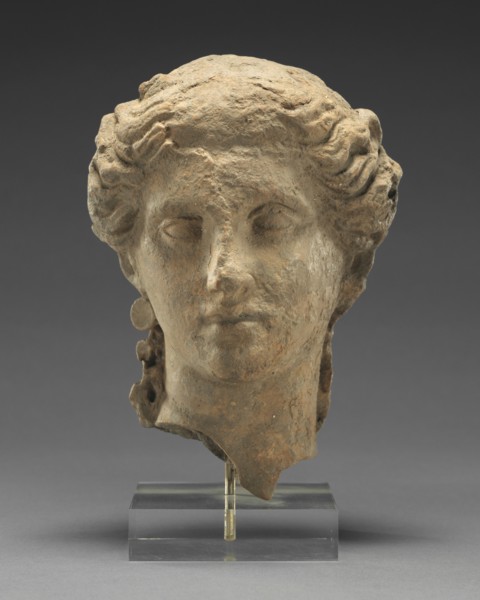 Head of a Woman; Tarentum, Taras, South Italy; 350 - 300 B.C; Terracotta with clay slip; 17.3 × 12.3 cm, 6 13,16 × 4 13,16 in
