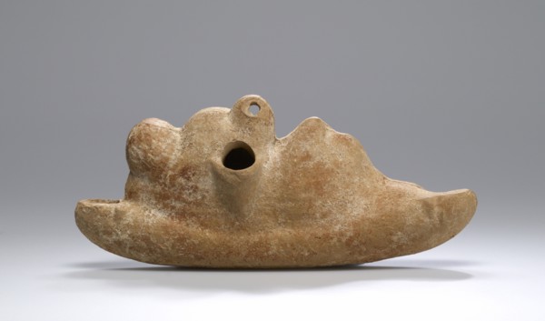 Lamp with a Reclining Comic Actor; Roman Empire; 2nd century; Terracotta and pigment; 7 × 16.3 cm, 2 3,4 × 6 7,16 in