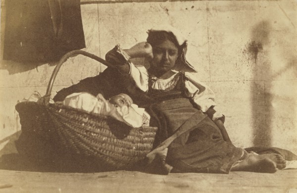 Barefoot girl leaning on basket with a doll; Giacomo Caneva, Italian, 1813 - 1865, Italy; about 1850s; Salted paper print