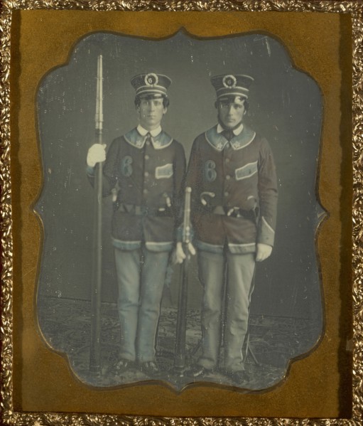 Portrait of Two Young Men in Uniform; American; about 1852; Daguerreotype, hand-colored; 7 x 5.6 cm 2 3,4 x 2 3,16 in