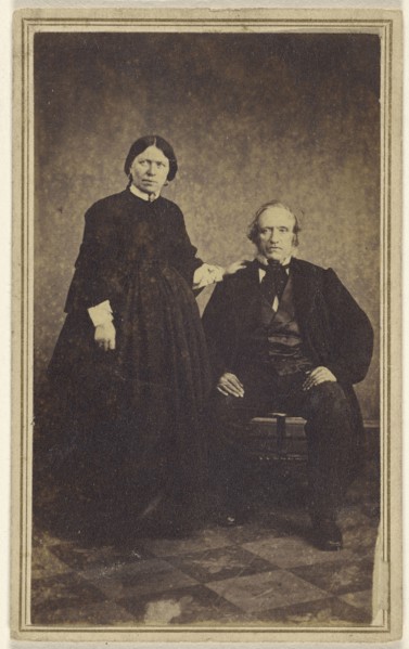 couple: woman standing, man seated; 1865 - 1870; Albumen silver print