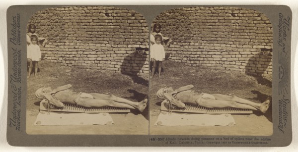 Hindu devotee doing penance on a bed of spikes near the shrine of Kali, Calcutta, India; Underwood & Underwood, American, 1881