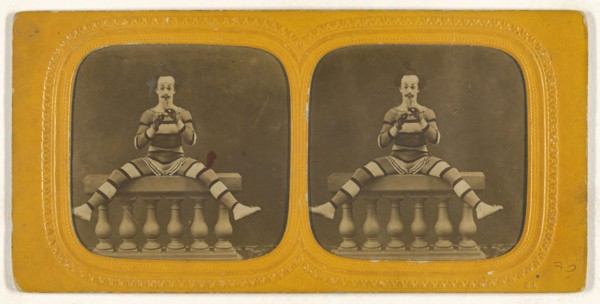 Harlequin playing a small flute; E. Lamy, French, active 1860s - 1870s, 1860s; Hand-colored Albumen silver print