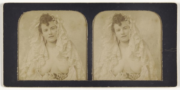 Woman wearing a lace mantilla with breasts exposed; French; 1855 - 1860; Hand-colored Albumen silver print
