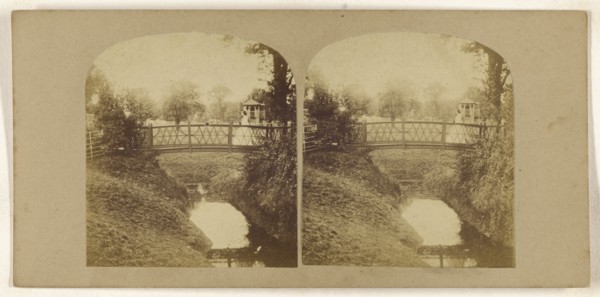 Woman crossing footbridge over stream; British; about 1860; Albumen silver print