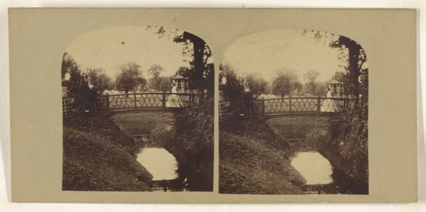Woman crossing footbridge over stream; British; about 1860; Albumen silver print