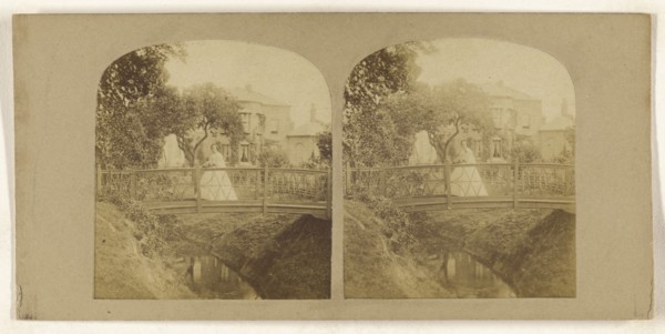 Woman crossing footbridge over stream; British; about 1860; Albumen silver print