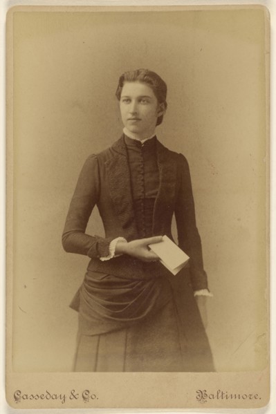 young woman holding a piece of folded paper, standing; Casseday & Company; 1880s; Albumen silver print