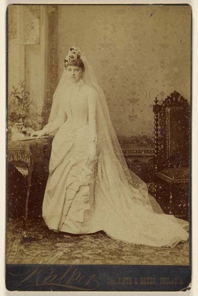 woman in wedding gown, standing; Walker; 1870s; Albumen silver print