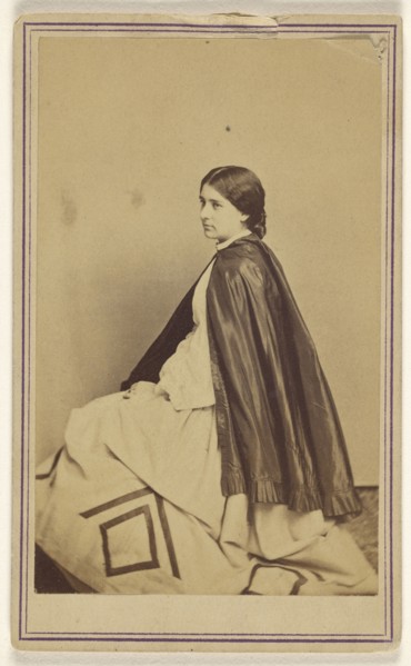 woman wearing a dark cape, seated, at 3,4 profile; Churchill & Denison; about 1867; Albumen silver print