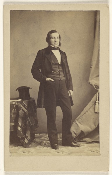 man with muttonchops, standing with his right hand in pocket, top hat on table; Bailly & Maurice; 1865-1870; Albumen silver