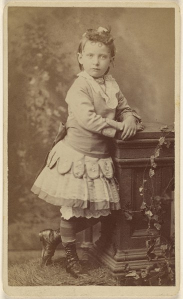 little girl, standing, leaning on a studio prop; Lee Stearns, American, active 1870s - 1910s, 1870 - 1875; Albumen silver print