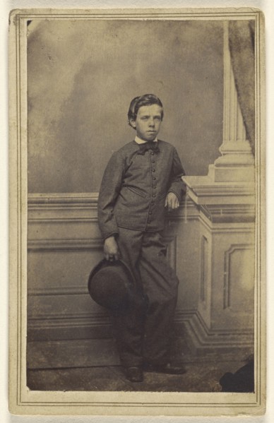 well-dressed young boy standing, holding a derby; S.B. Howard, American, active Pottsville and Reading, Pennsylvania 1860s
