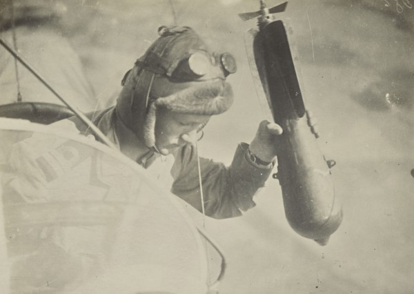 Man in airplane dropping a bomb; Fédèle Azari, Italian, 1895 - 1930, Italy; 1914 - 1918; Gelatin silver print; 11.3 x 16 cm