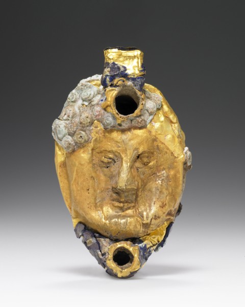 Lamp with Mask overlaid with gold foil; Roman Empire; 1st century B.C. - 1st century A.D; Glass, gold; 7 x 2.4 cm