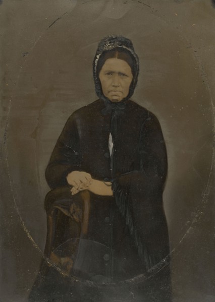 Portrait of woman in bonnet; United States; 1860s - 1880s; Hand-colored tintype; Sheet: 35.8 × 25.6 cm, 14 1,8 × 10 1,16 in