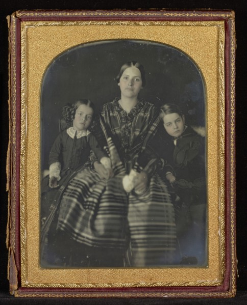 Portrait of a Seated Woman with a Young Girl and Boy on Either Side; Mexico; about 1850s; Hand-colored Daguerreotype