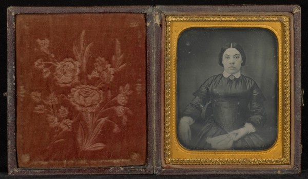 Portrait of a Woman in a Black Dress Seated and Holding a Fan; Mexico; 1856; Hand-colored Daguerreotype