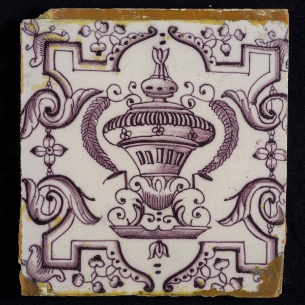 Tile, purple on white, vase with round floral ornaments, framed by régence decoration, wall tile tile sculpture ceramic