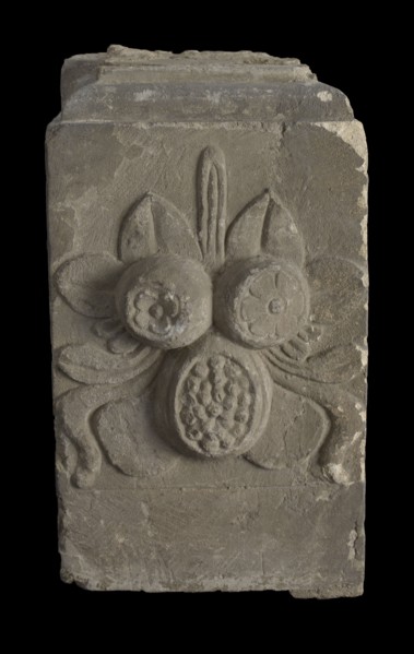 Basement with fruits and leaves, part of chimney, basement pilaster ornament building component sandstone stone, sculpted