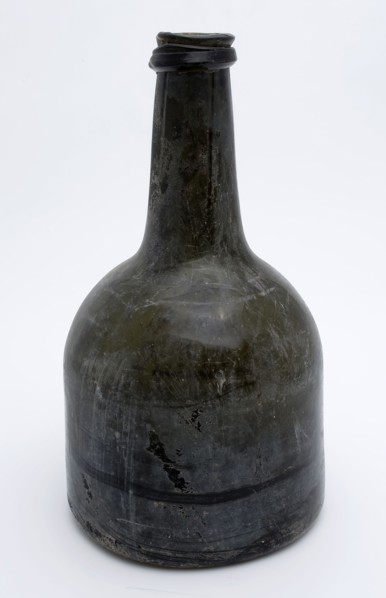 Cylindrical (wine) bottle, clock model, bottle holder bottomfound glass, free blown and molded in mold blown glass application