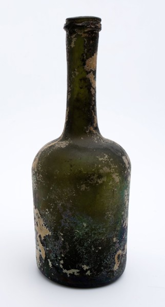 Cylindrical bottle, bottle holder bottomfound glass, free blown and shaped glass application Cylindrical bottle in clear green