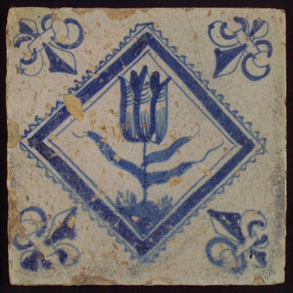 Tile, tulip on ground in blue on white, inside serrated square, corner pattern french lily, wall tile tile sculpture ceramic