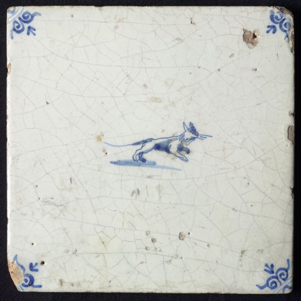 Animal tile, jumping cat to the right, in blue on white, corner motif; ox head, wall tile tile sculpture ceramic earthenware