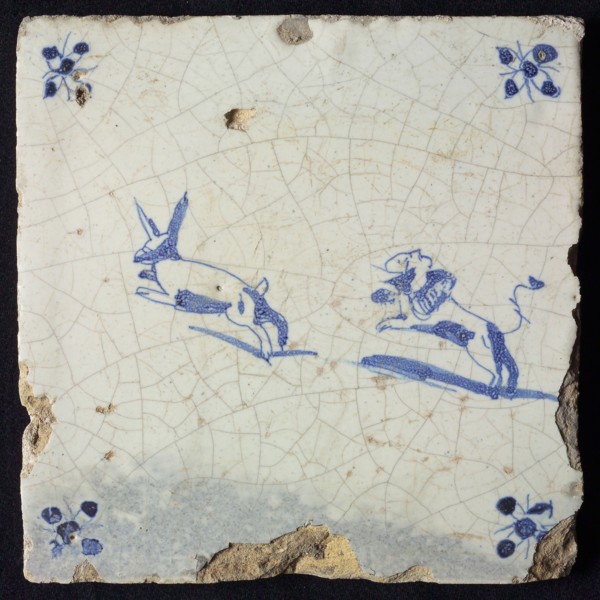 Animal tile, jumping hare followed by jumping dog to the left, in blue on white, corner motif spider, wall tile tile sculpture