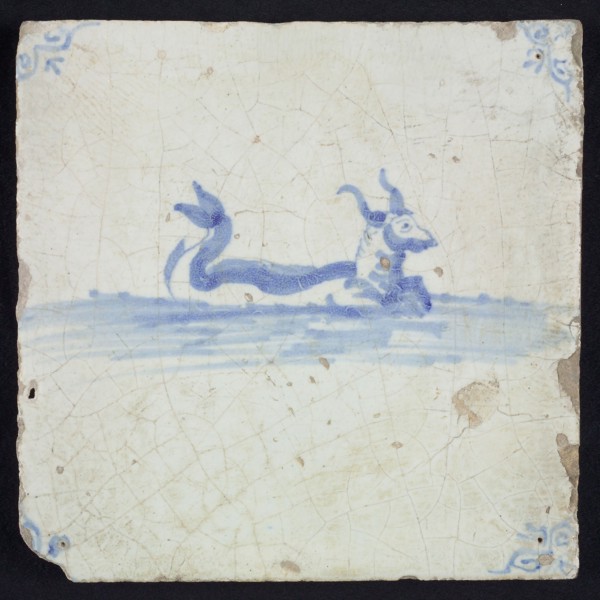 Sea creature tile, bovine with horns and curled fish tail in running water to the right, in blue on white, corner motif oxen