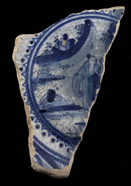 Fragment majolica dish, blue on white, with Chinese in landscape in circle with serrated edge, dish tableware holder earth
