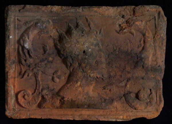 Hearthstone, from Antwerp Belgium, with narrow frame, with crowned man and dolphinvoluten, hearth fireplace part ceramic brick