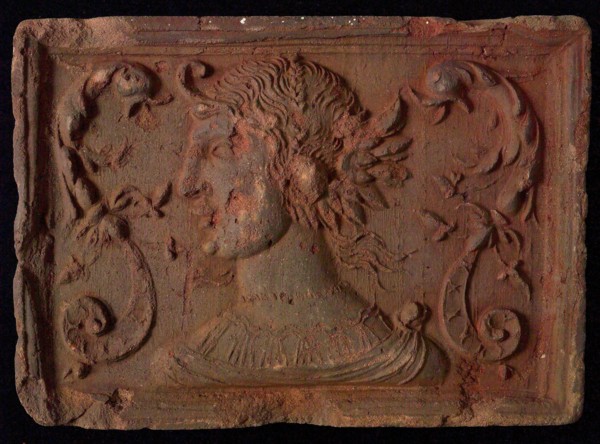 Hearthstone, from Antwerp Belgium, with narrow frame, with woman's head and dolphin's fads, hearth fireplace component ceramics