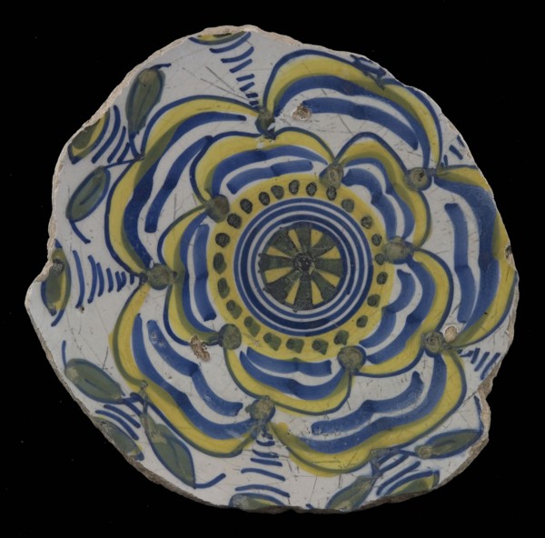 Fragment majolica dish, yellow, green and blue on white, with stylized rose (Tudor rose?), dish plate crockery holder earth