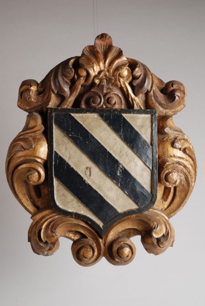 Charlois carved and painted coat of arms in frame of curling motifs, coat of arms information form carvings sculpture footage