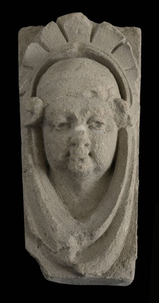 Keystone with gable head, female head with cap, keystone gable ornament building component limestone stone, sculpted Above wider
