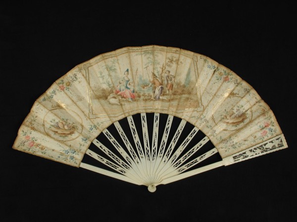 Folding fan with carved ivory frame and multicolored painted parchment leaf with rococo motifs and pastoral scene, folding fan