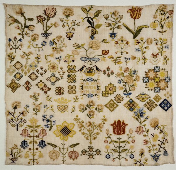 Sampler worked in rococo or bundle stitch with colored silk on loosely woven cream-colored linen in floral motifs, marked 1742