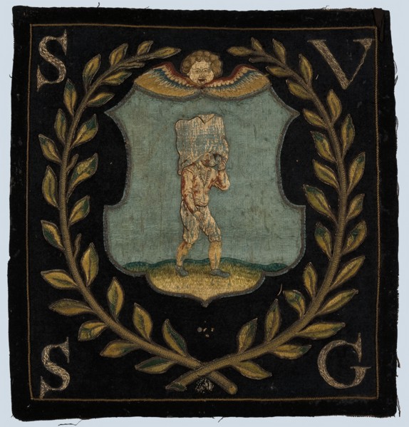 Blazon of black cloth with application and (gold) embroidery, cherub head above shield with pocket carrier to the right, laurel
