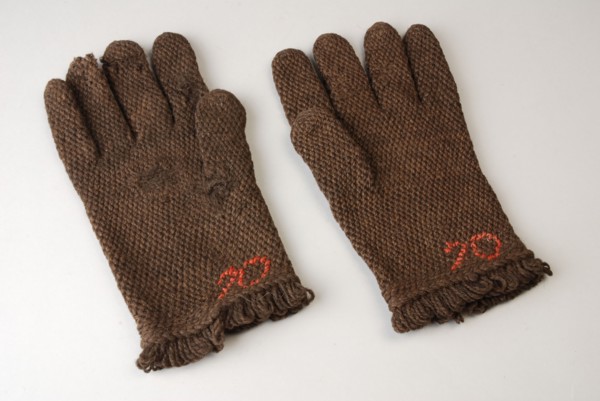 Pair of gloves made of dark brown wool, rough knit, stopped and marked 70, uniform part of the police, glove hand-covering