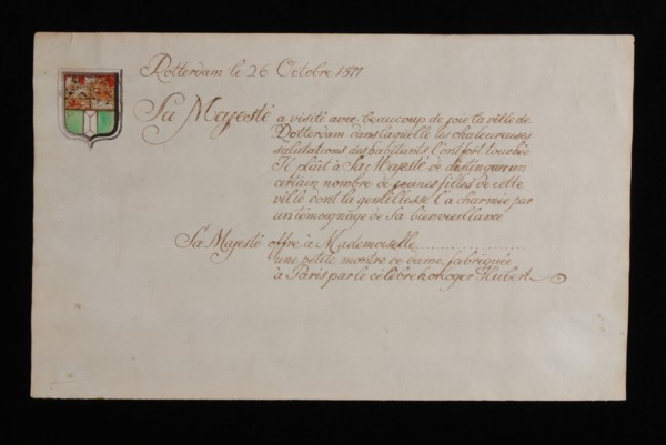 Handwritten sheet with French text about Napoleon's visit to Rotterdam, magazine accompanies donation of ladies watch