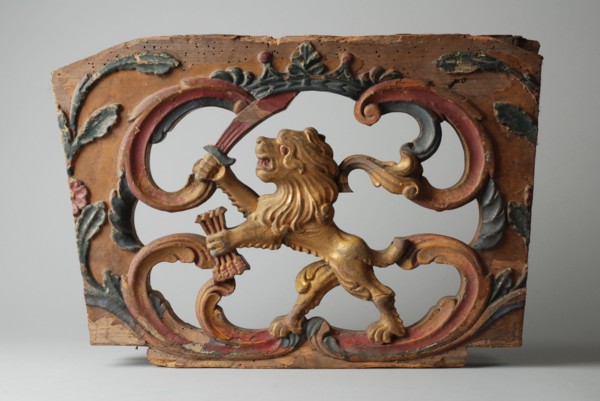 Wooden ornament of wagon with standing lion with sword and arrows bundle, ornament part wood carving sculpture sculpture wood